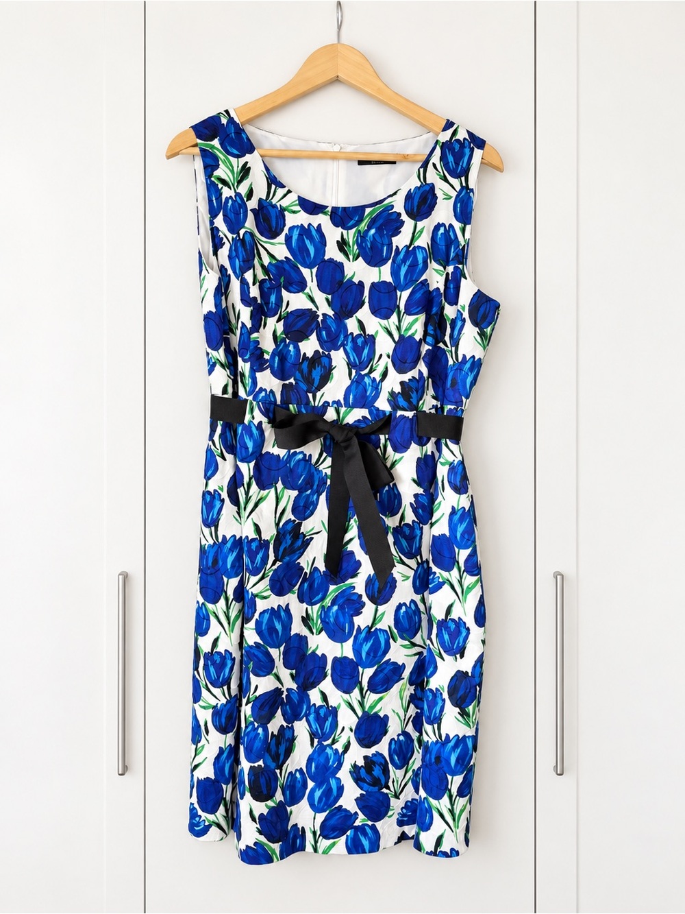 Sleeveless White Midi Dress with Blue Floral Print and Black Waist Tie